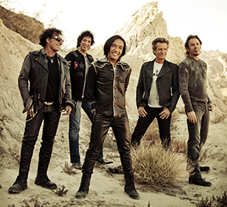 Photo of the band Journey in the desert.